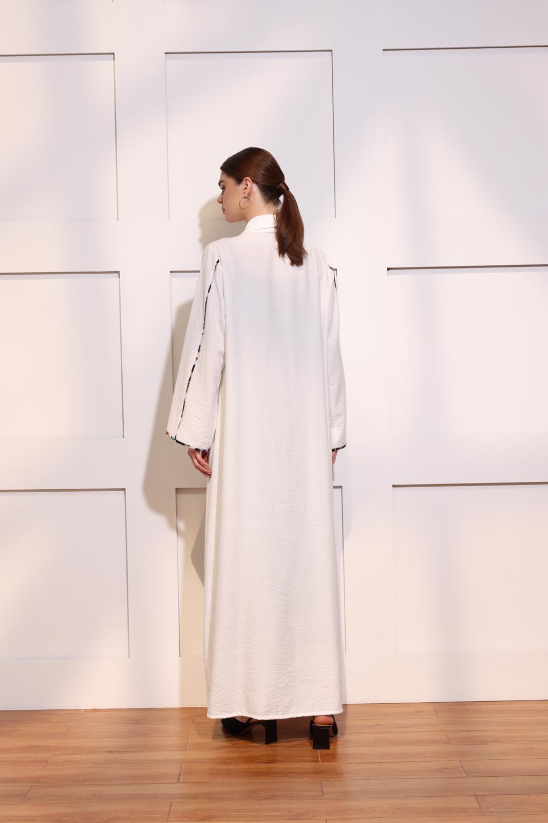 White linen abaya with floral piping