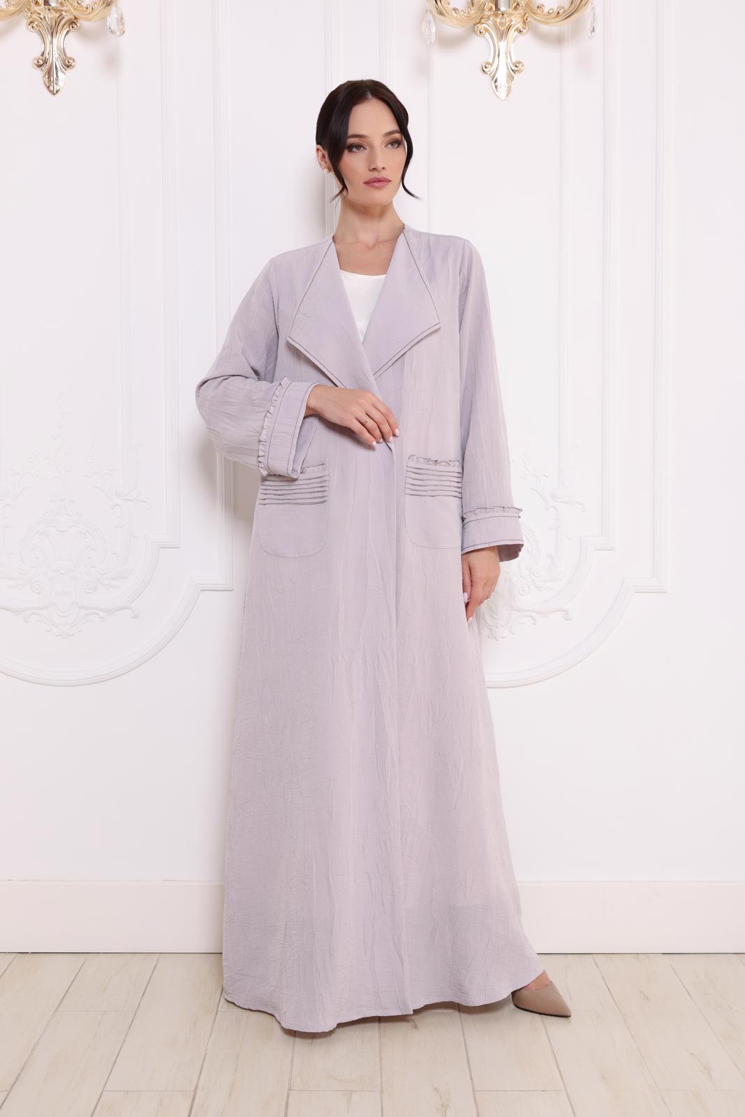 Pleated patch pockets Abaya with ruffle detailed cuffs.